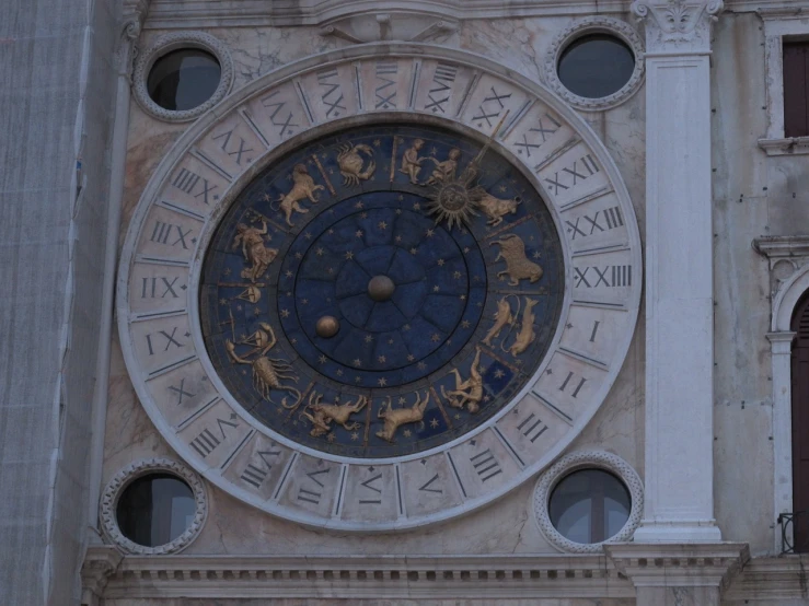 a large clock on the side of a building, by Taddeo Gaddi, baroque, unknown zodiac sign, blocking the sun, indigo! and venetian red!, wikipedia