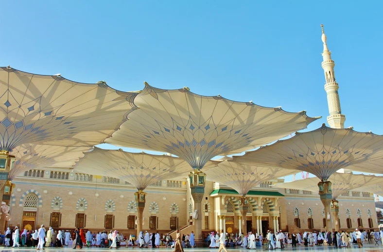 a group of people standing in front of a building, a picture, shutterstock, hurufiyya, complex ceiling, parasols, pure gold pillars, during the day