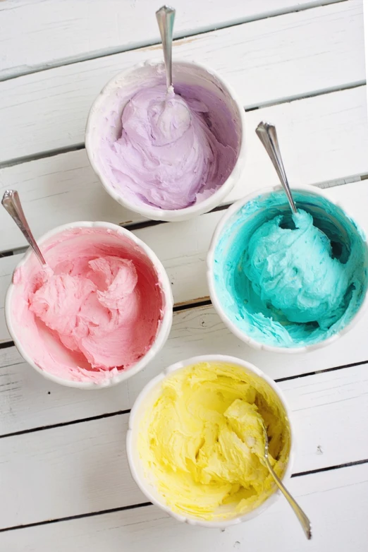 three bowls of colored ice cream with spoons, a pastel, by Sylvia Wishart, tumblr, color field, baking a cake, paints mixing, whipped cream, turquoise pink and yellow