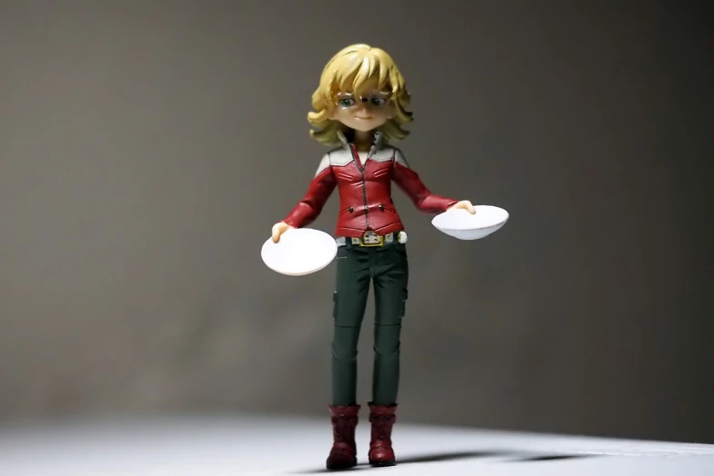 a close up of a figurine of a person holding a frisbee, inspired by Yumihiko Amano, trending on cg society, dau-al-set, curly blonde hair | d & d, kamen rider action pose, full body full height, ( ( ( wearing jeans ) ) )