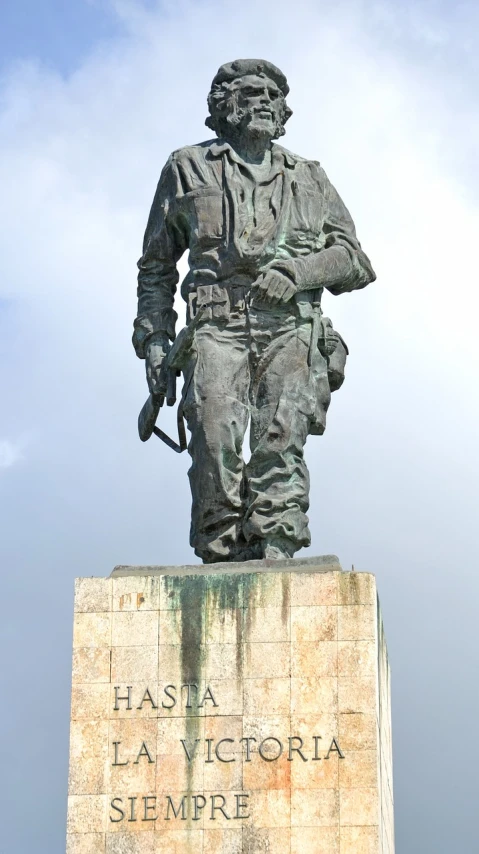 a statue of a man holding a rifle, wearing a flying jacket, nazare (portugal), josip broz tito, full-body view