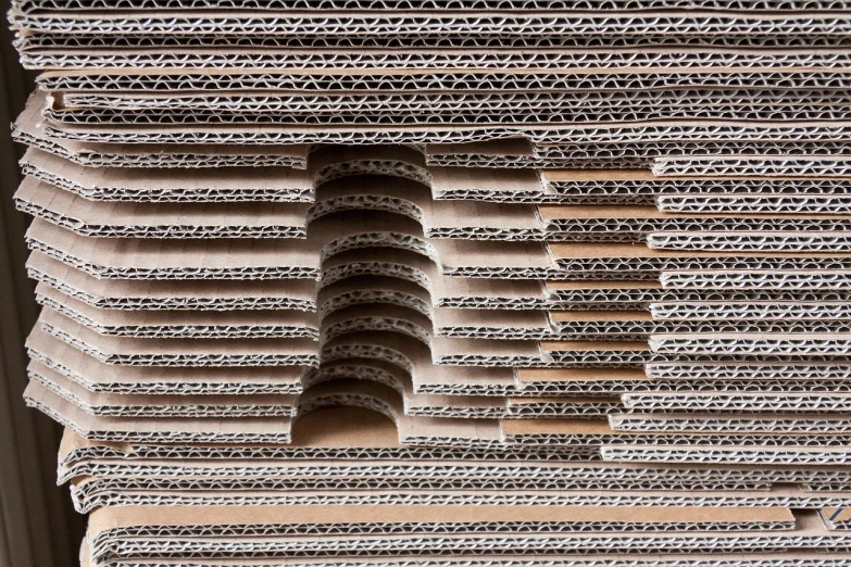 a stack of pizza boxes stacked on top of each other, a stock photo, inspired by Andreas Gursky, kinetic pointillism, vincent callebaut, detail structure, cardboard tunnels, iranian