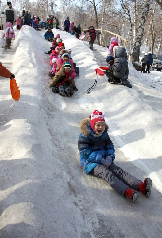 a group of people riding down a snow covered slope, a portrait, pixabay, mingei, people falling off a playground, big smile, russian and japanese mix, file photo
