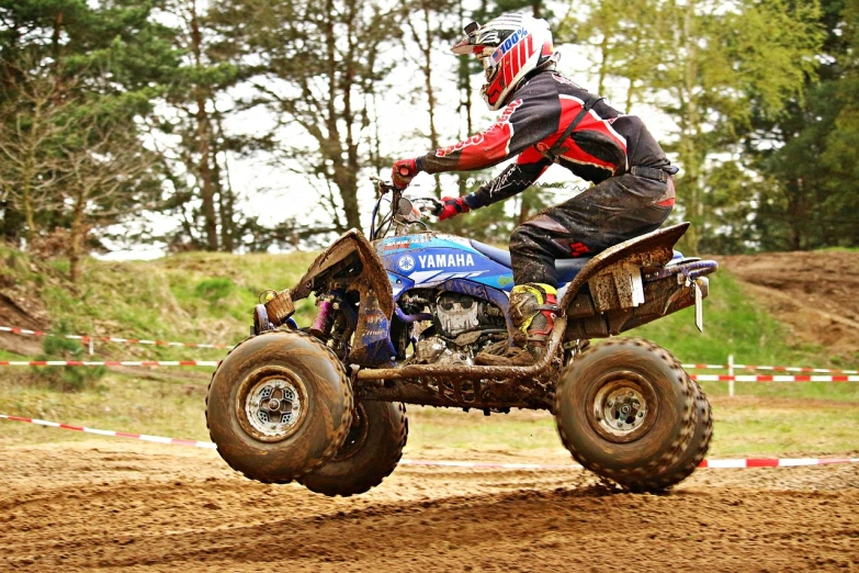 a man riding on the back of a dirt bike, all terrain vehicle race, ebay photo, graham humphreys, injured