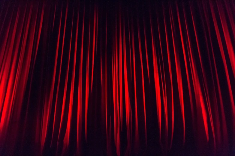 a close up of a red curtain on a stage, a picture, by Edward Corbett, pexels, visual art, twin peaks, theater dance scene, cinestill 5 0 0, luminescent fabrics