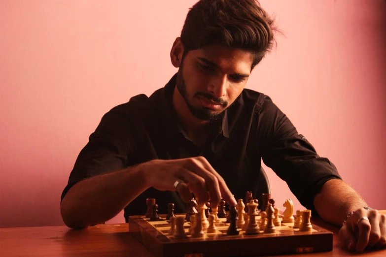 a man is playing a game of chess, by Max Dauthendey, indiecraft aesthetic, handsome, profile picture, ayan nag