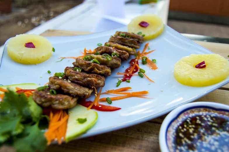 a close up of a plate of food on a table, a picture, by Adam Manyoki, pork, beautiful sunny day, japanese fusion cuisine, very sharp photo