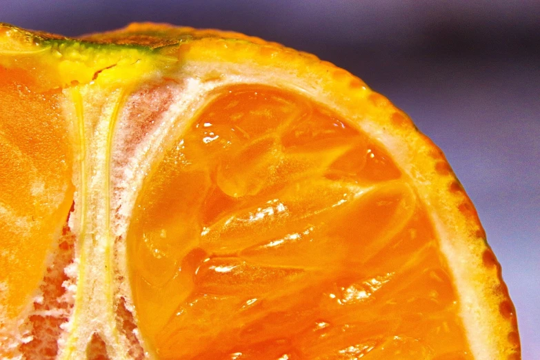 a close up of an orange cut in half, a macro photograph, by Jon Coffelt, glazed, hdr detail, marmalade, hyperdetailed!