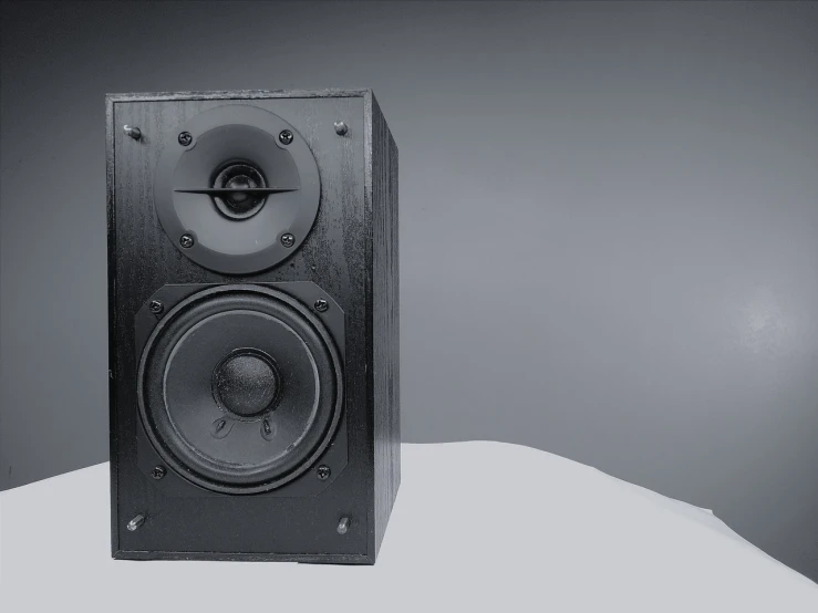 a pair of speakers sitting on top of a table, a 3D render, polycount, minimalism, album photo, 90s photo, black interface, product introduction photo