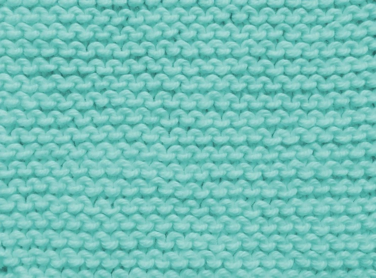 a close up of a blue knitted blanket, a digital rendering, close-up product photo, textured turquoise background, high detail product photo, real photo