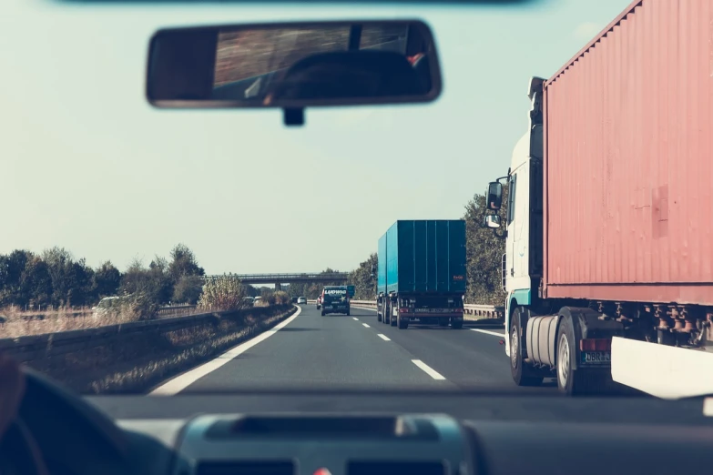 a view from the driver's seat of a truck driving down a highway, a tilt shift photo, old color photo, traffic accident, document photo, lowres