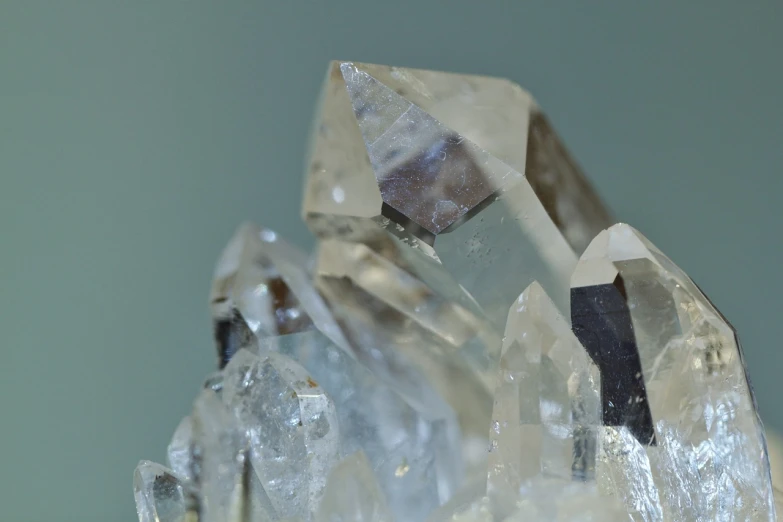 a cluster of crystals sitting on top of a table, a macro photograph, by Karel Štěch, close-up product photo, ashe, full image