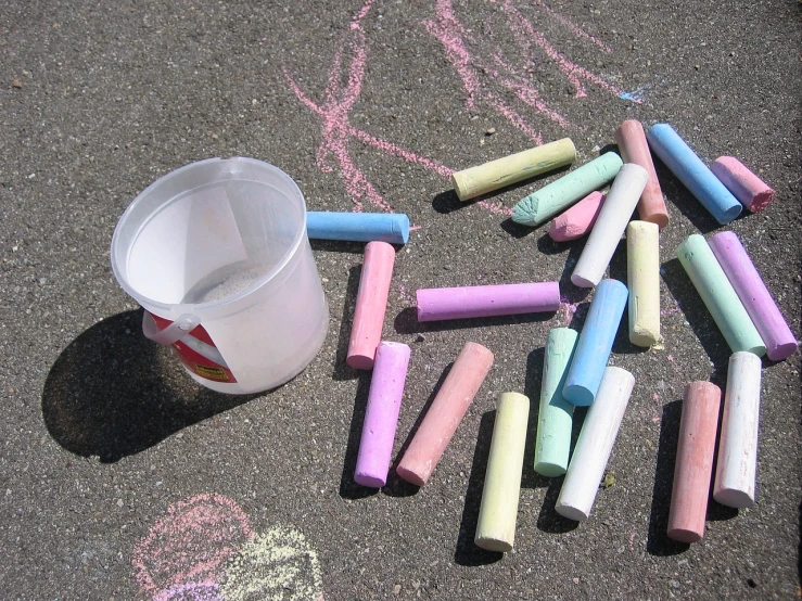 a bucket of chalk next to a bunch of crayons, chalk art, by Jan Rustem, flickr, having fun in the sun, effervescent, race, panzer