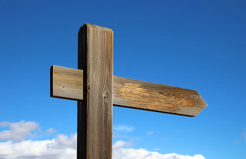 a wooden cross with a blue sky in the background, a picture, by David Simpson, directions, looking this way, big sky, albuquerque