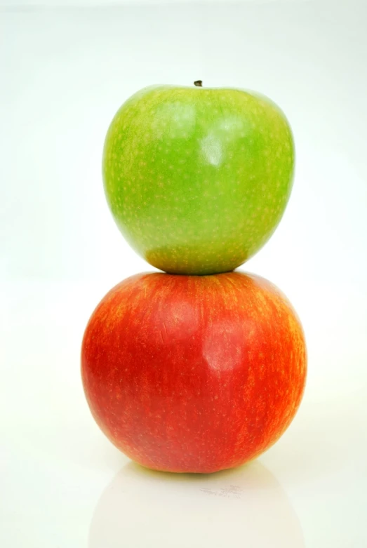 two apples stacked on top of each other, a picture, full of colour 8-w 1024, far away shot, smooth color, tall and small