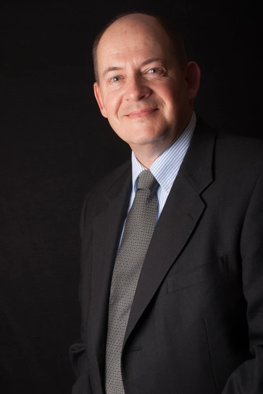 a man in a suit and tie posing for a picture, by Richard Carline, well lit professional photo, eliezer yudkowsky, 2 0 1 2, ceo