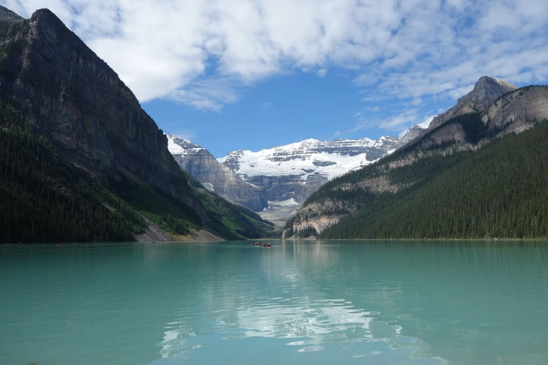 a body of water with a mountain in the background, a picture, by Brigette Barrager, wikimedia commons, glacier photography, toronto, very smooth