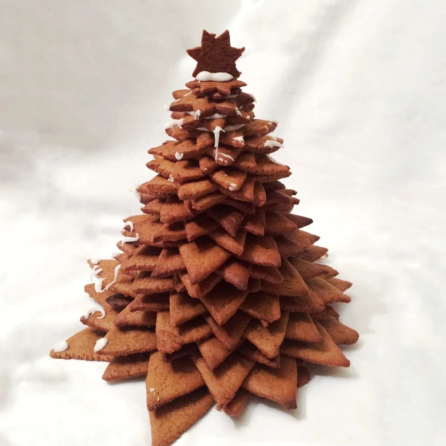 a christmas tree made out of cookies on a table, by Aleksander Gierymski, renaissance, cinnamon skin color, 3/4 view from below, tower, etsy