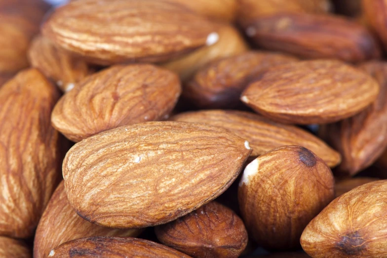 a pile of almonds sitting on top of each other, a portrait, watch photo, istockphoto, high detail product photo, high detail photo