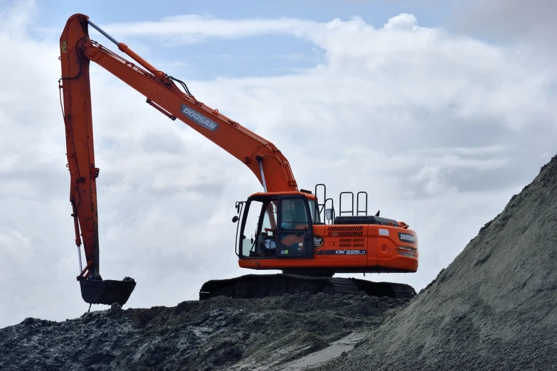 a large orange excavator sitting on top of a pile of dirt, a portrait, figuration libre, panorama, 2 0 2 2 photo, flying machinery, on top of it