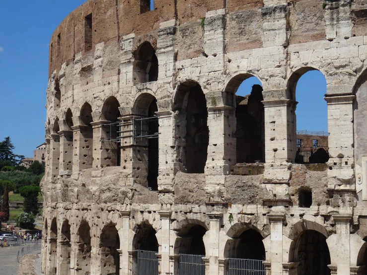 a view of the colossion of the colossion of the colossion of the colossion of the colossion in, inspired by Romano Vio, pexels, neoclassicism, inside the roman colliseum, crenellated balconies, side view from afar, traditional roman armor