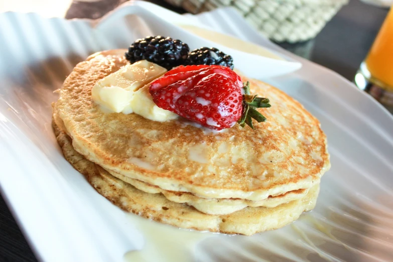 a stack of pancakes sitting on top of a white plate, a portrait, by Pat Adams, flickr, squashed berries, rich texture, recipe, highly detailed shot