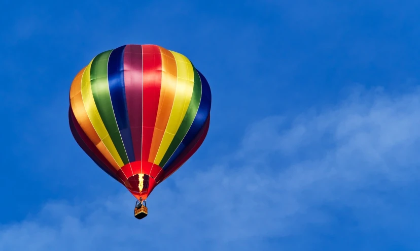 a colorful hot air balloon flying through a blue sky, by Jan Rustem, shutterstock, hero shot, hd wallpaper, stock photo, full of colour w 1024