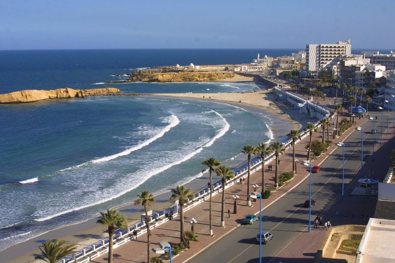 a street lined with palm trees next to the ocean, a picture, hurufiyya, moroccan city, view from high, beaching, alexandria\'s genesis