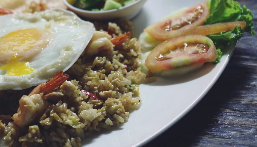 a close up of a plate of food on a table, a picture, unsplash, hurufiyya, rice, background image, greenish tinge, square