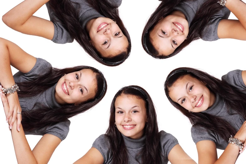 a group of young women standing next to each other, a picture, by Juan O'Gorman, pixabay, antipodeans, symmetrical mouth, dslr photo of a pretty teen girl, smiling down from above, with a white background