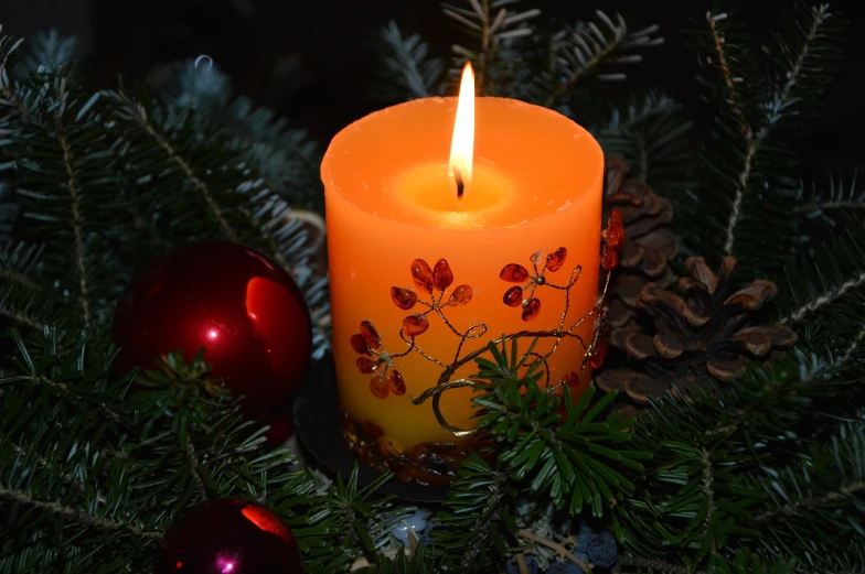 a lit candle sitting on top of a christmas tree, a portrait, pixabay, folk art, covered in flame porcelain vine, with sparkling gems on top, - h 1 0 2 4, an orange