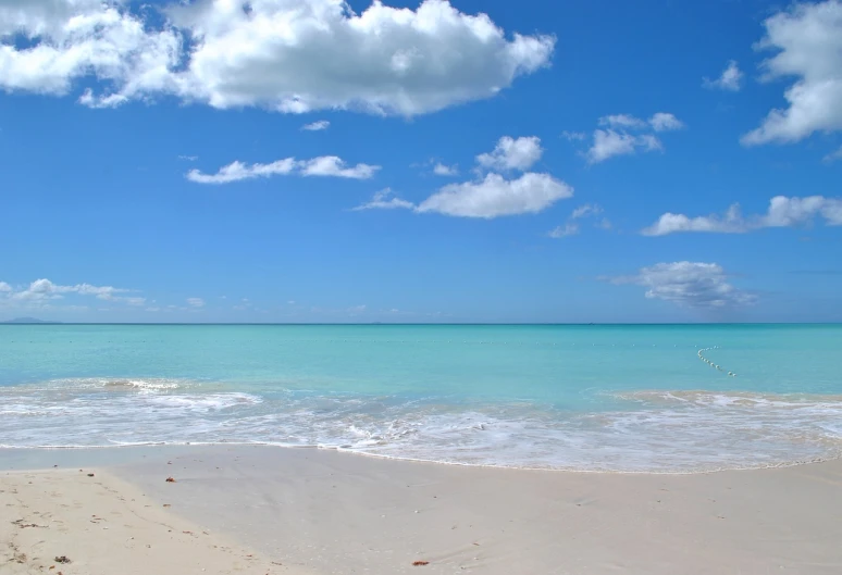 a large body of water sitting on top of a sandy beach, azure sky, varadero beach, wallpaper for monitor, setting is bliss wallpaper