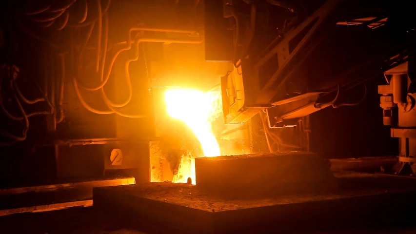 a close up of a metal object in a factory, a picture, by Jeffrey Smith, pixabay, breathing fire, stock footage, koyaanisqatsi, pouring