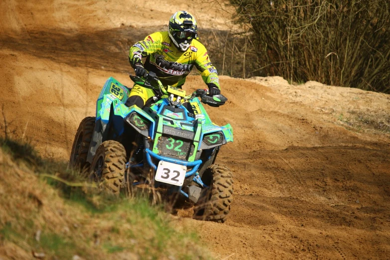 a man riding on the back of a blue and green atv, a photo, by Derek Hill, flickr, race, avatar image, modelling, 1 0 0 m