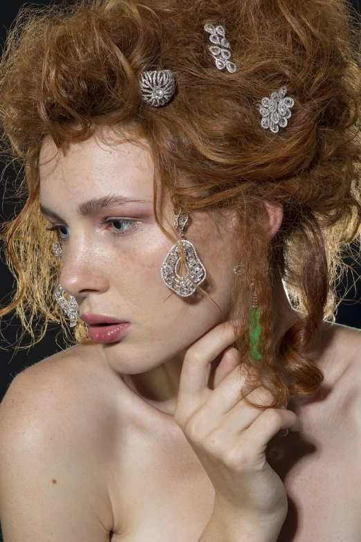 a close up of a woman with red hair, inspired by Hendrick van Balen, rococo, silver earrings, editorial model, filigree jewellery, multiple earrings