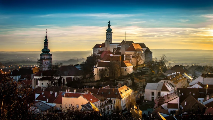 a large castle sitting on top of a hill, by Antoni Brodowski, pexels contest winner, baroque, sun and shadow over a city, anthony moravian, quaint village, ornately dressed