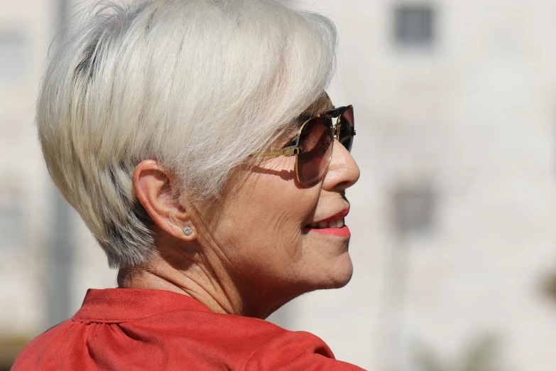 a close up of a person wearing sunglasses, by senior artist, beautiful daylight, white haired lady, sharp photo, above side view