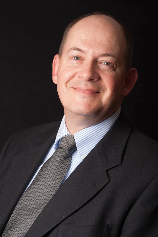 a man in a suit and tie posing for a picture, by Richard Carline, headshot photo, ian sprigger, stephen outram, corporate photo