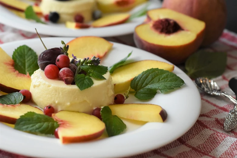 a close up of two plates of food on a table, inspired by Rudolf von Alt, trending on pixabay, renaissance, with fruit trees, flan, peaches, creamy