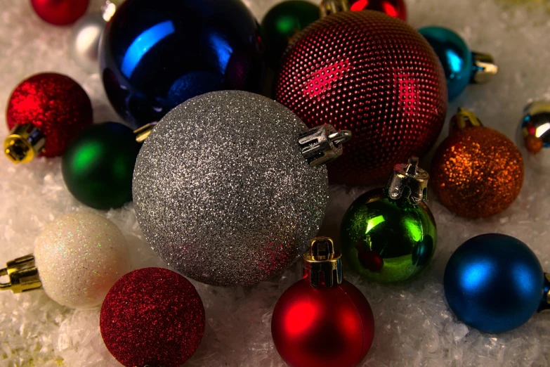 a pile of christmas ornaments sitting on top of a snow covered ground, inspired by Ernest William Christmas, - h 1 0 2 4, chromatic, up close picture, h 7 0 4