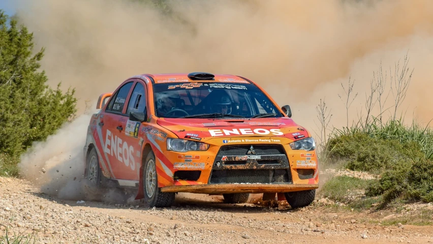 a car that is driving on a dirt road, a picture, shutterstock, shin hanga, orange racing stripes, alexandros pyromallis, a wide full shot, fans