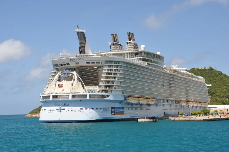 a large cruise ship in a body of water, a picture, by Edward Corbett, shutterstock, viewed from the harbor, shell, built around ocean, caribbean