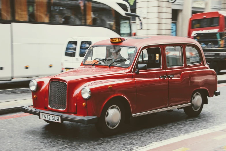 a red taxi driving down a city street, shutterstock, fine art, retro colour, british street background, gif, watch photo