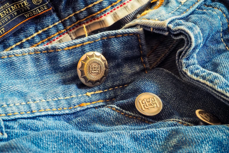 a close up of a button on a pair of jeans, by Eugeniusz Zak, pexels, renaissance, intricate detail realism hdr, hot summer sun, depth of field : - 2, zippers