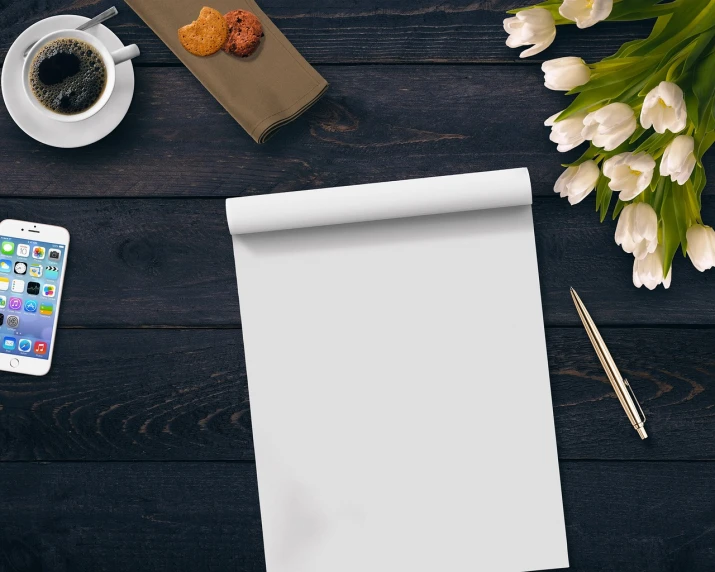 a notepad sitting on top of a wooden table next to a cup of coffee, pexels contest winner, flowers, slick elegant design, background image, an illustration