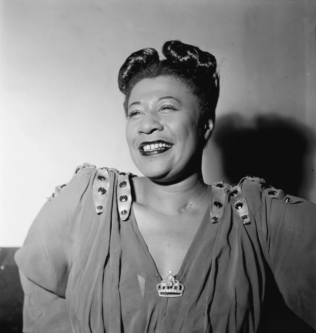 a black and white photo of a woman smiling, a portrait, by Maurycy Gottlieb, flickr, harlem renaissance, garbed in a purple gown, radiant smile. ultra wide shot, a portrait of a plump woman, stained”