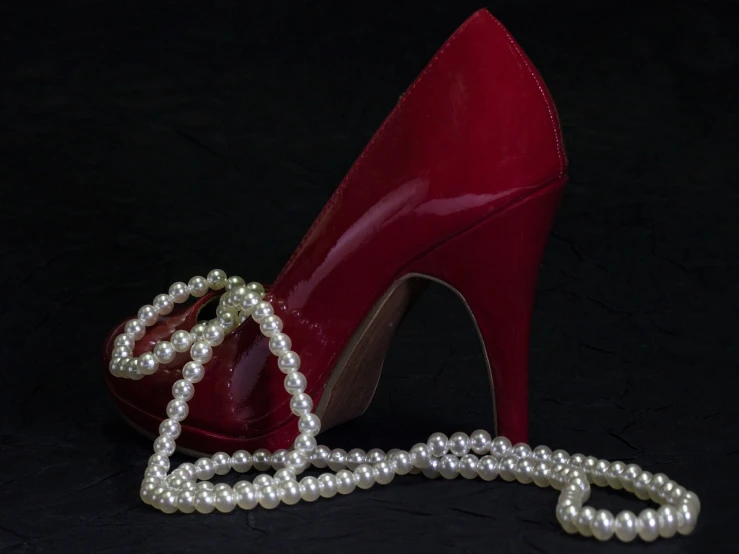 a pair of red high heels and a pearl necklace, by John Murdoch, pixabay, renaissance, seductive and powerful, biopic, nigth, lacquered