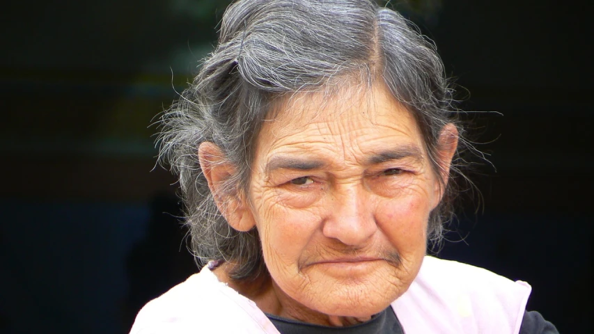 a close up of a person with a cell phone, by Anita Kunz, flickr, photorealism, elderly greek goddess, in chuquicamata, taken with a pentax k1000, beautiful well rounded face