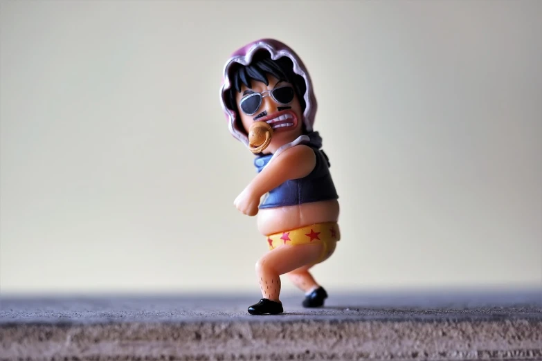 a close up of a figurine of a person, a picture, unsplash, funk art, chris farley, betty boop, badass pose, markiplier