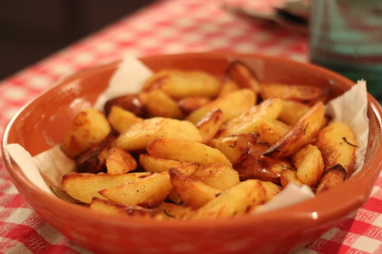 a close up of a bowl of food on a table, a picture, inspired by Pia Fries, figuration libre, potatoes, very crispy, chilean, homemade